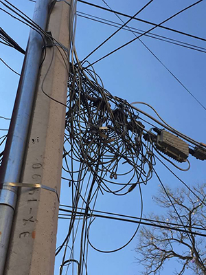 tangled broadband wires on utility pole
